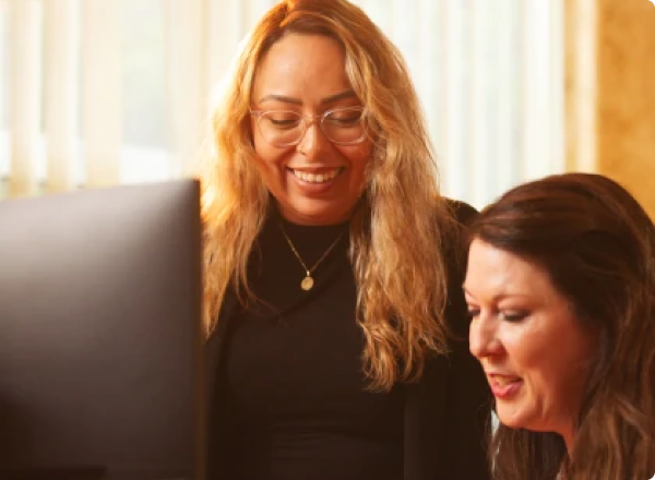 Two customer support team members at RentalMatics